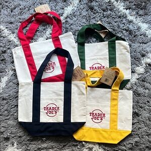 Trader Joe’s mini canvas tote bags. Set of four. Blue. Red. Green. Yellow. New.